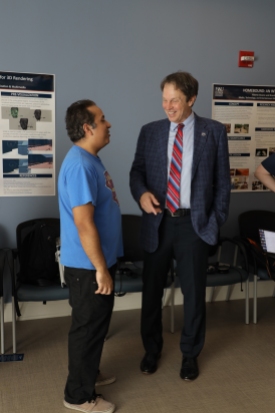 FAU President John Kelly discussing our research with MTEn MFA student Andres Venton at Research Encounter 2020.